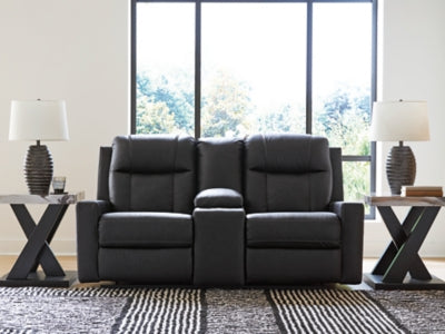 Ashley Furniture Mackmenville reclining loveseat with console, featuring plush fabric, cushioned armrests, and built-in cup holders.