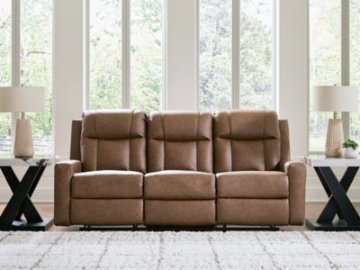 Ashley Furniture Mackmenville reclining sofa with plush cushions and a neutral fabric finish, shown in a close-up view.