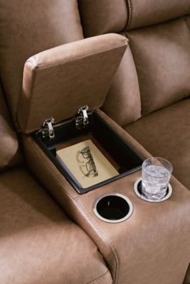 Ashley Furniture Mackmenville reclining loveseat with built-in console, featuring plush upholstery and wide armrests for comfort.