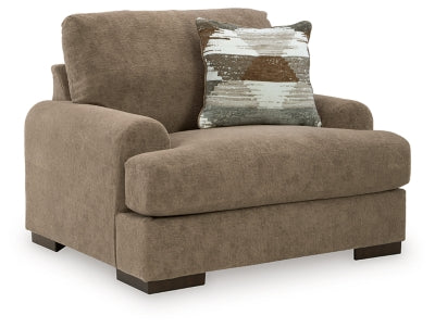 Ashley Furniture Jayne Park oversized chair with plush upholstery and wide armrests, shown from an angled side view.