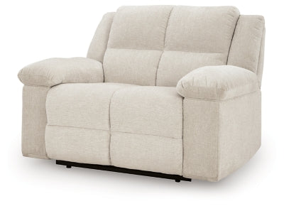 Ashley Furniture Orlen oversized recliner in neutral fabric, shown from an angle with the reclined back and plush cushioning.