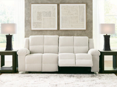 Ashley Furniture Orlen reclining sofa with plush cushions and modern design, shown in an open position in the image.