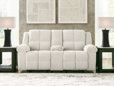 Ashley Furniture Orlen reclining loveseat with console, featuring plush fabric, padded armrests, and built-in cup holders.