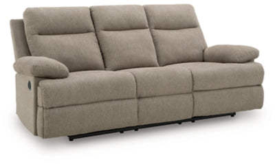 Ashley Furniture side-swipe reclining sofa with drop-down table, featuring plush cushions and modern design, shown from an angled view.
