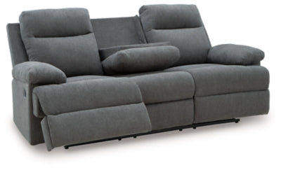 Ashley Furniture side-swipe reclining sofa with drop-down table, shown from an open angle highlighting the plush cushions and built-in table.