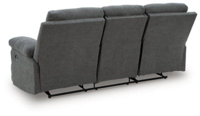 Ashley Furniture Side-Swipe Reclining Sofa with Drop-Down Table, showing plush fabric, reclining seats, and built-in table feature.