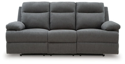 Ashley Furniture side-swipe reclining sofa with drop-down table, shown in a head-on view with closed side panels and sleek design.
