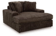 Ashley Furniture Midnight-Madness oversized chaise chair with plush upholstery, shown from an angled side view.
