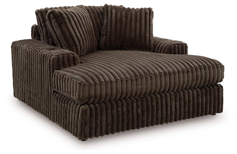 Ashley Furniture Midnight-Madness oversized chaise chair with plush upholstery, shown from an angled side view.