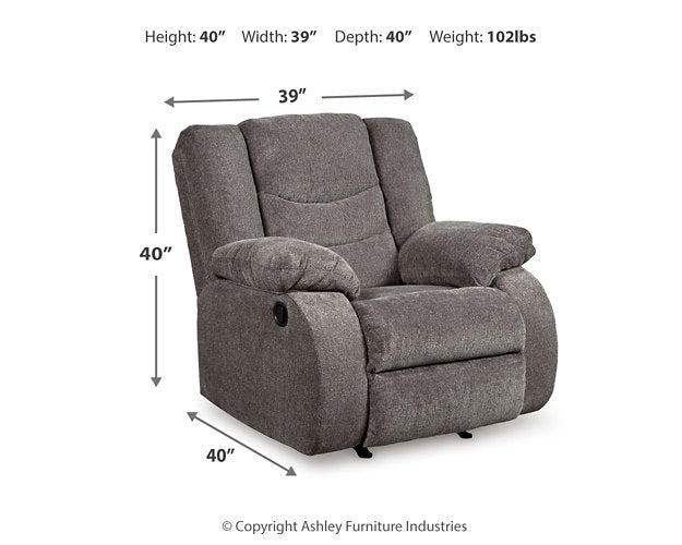 Ashley Furniture Tulen recliner in a taupe fabric, showing the plush, padded armrests and comfortable reclined position.