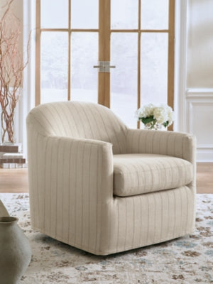 Ashley Furniture Valwick swivel accent chair with plush fabric and modern design, shown in a cozy living room setting.