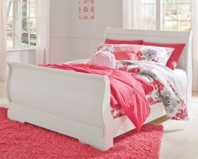 Ashley Furniture Anarasia Bed with a stylish wooden frame and detailed headboard, shown in a bedroom setting.