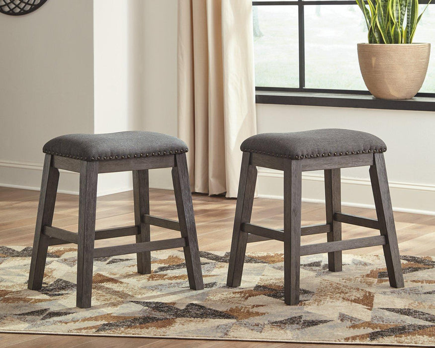 Set of Ashley Furniture Caitbrook counter height barstools for dining, featuring wooden seats and metal legs, ideal for kitchen counters.