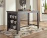 Counter height dining table by Ashley Furniture featuring a sturdy wooden surface and modern design for casual meals.