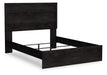Ashley Furniture Belachime bed with a wooden frame and upholstered headboard, shown in a modern bedroom setting.