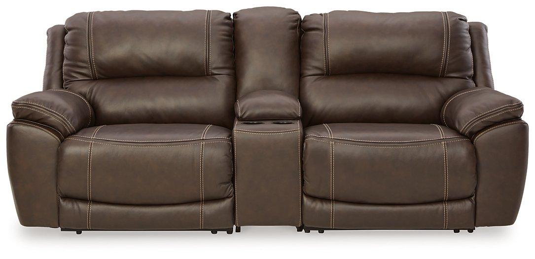 Ashley Furniture Dunleith power reclining sectional loveseat with console, showing plush fabric, built-in cup holders, and reclining features.