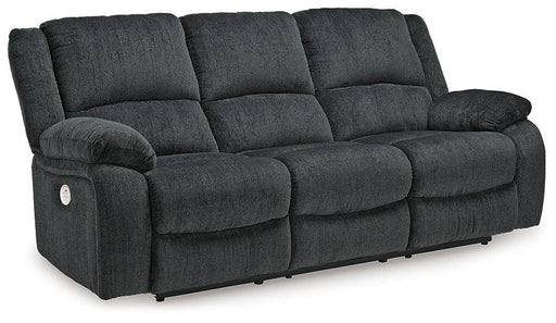 Ashley Furniture Draycoll power reclining sofa with plush cushions and a modern design, shown in a cozy living room setting.