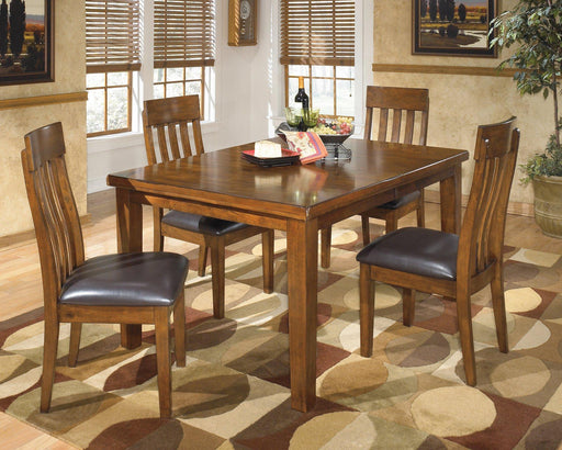Ashley Furniture Ralene dining room set with a wooden table and matching chairs, modern design ideal for dining spaces.