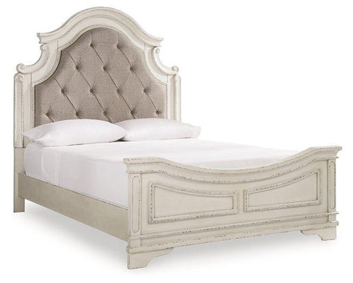 Ashley Furniture Realyn upholstered bed with a padded headboard and elegant fabric finish, showcasing a modern bedroom design.