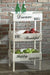 Ashley Furniture Yulton Kitchen Storage Shelf with multiple shelves for organized kitchen storage, shown in a modern setting.