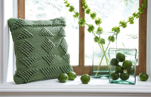 Rustingmere Pillow by Ashley Furniture, soft decorative pillow with textured fabric and neutral tones for cozy home decor.