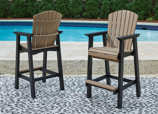Set of two Ashley Furniture Fairen outdoor barstools with woven seats and metal frames on a patio setting.