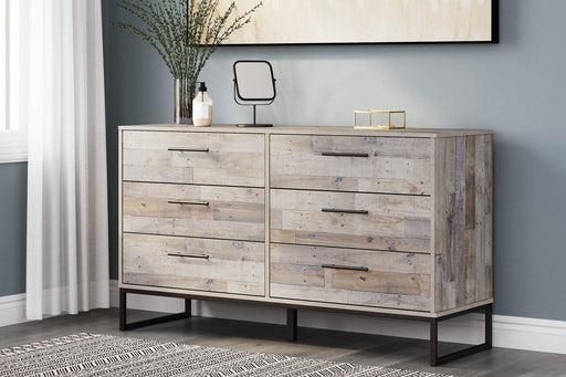 Ashley Furniture Neilsville Dresser with multiple drawers and wood finish, showcasing its elegant bedroom storage design.