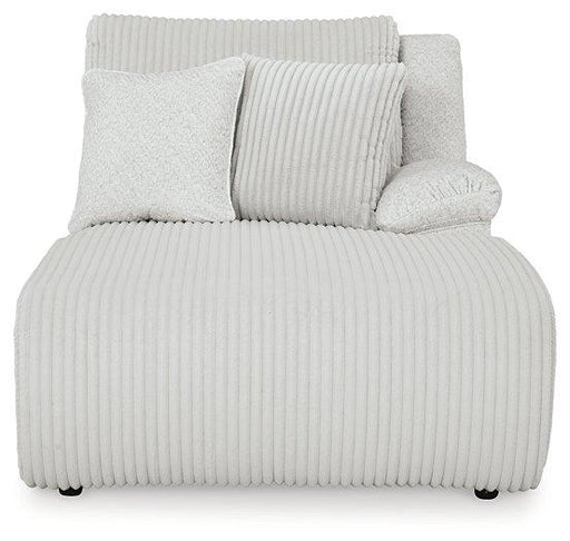 Ashley Furniture Top Tier Sectional Chofa with plush cushions and modern design, shown in a cozy living room setting.