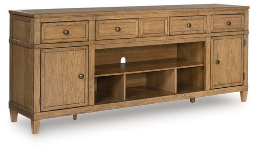 Ashley Furniture Sharlance 81-inch TV stand with open shelves and storage cabinets in a modern wood finish.