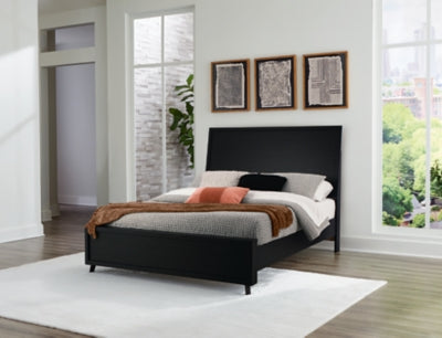 Ashley Furniture Danziar Bed with a sleek wooden frame and modern design, shown in a stylish bedroom setting.