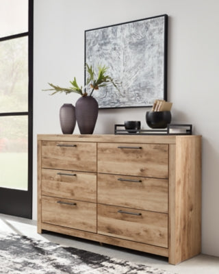 Ashley Furniture Hyanna dresser with matching mirror, featuring a modern wooden design and sleek hardware for bedroom storage.