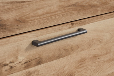 Ashley Furniture Hyanna chest of drawers with detailed handles, showcasing a stylish wooden storage piece.