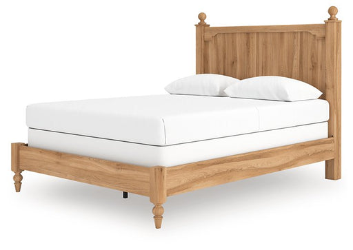 Ashley Furniture Aleaport Bed with a modern design, showing a sleek wooden frame and headboard in a bedroom setting.