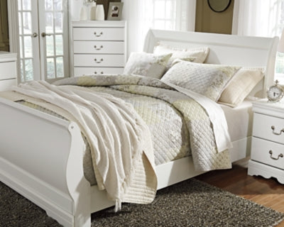 Ashley Furniture Anarasia Bed with elegant headboard and wood finish, showcasing a stylish bedroom centerpiece.