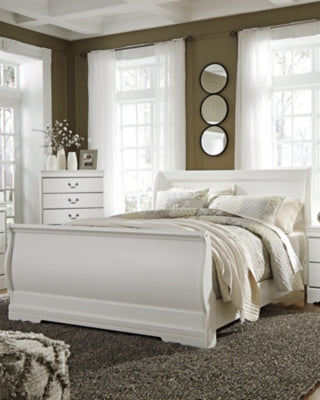Ashley Furniture Anarasia bed with a stylish headboard and neutral-toned upholstery, showcasing a modern bedroom design.