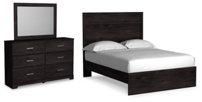 Ashley Furniture Belachime bedroom set with a bed, nightstands, and dresser in a modern design featuring neutral tones.