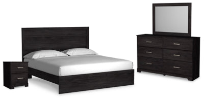 Ashley Furniture Belachime bedroom set includes a bed frame, dresser, and nightstands in a modern bedroom design.