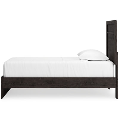 Ashley Furniture Belachime Bed with a wooden frame and sleek design, shown from a side angle in the image.
