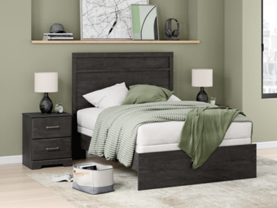 Ashley Furniture Belachime bed with a dark wood finish and elegant headboard, shown in a modern bedroom setting.