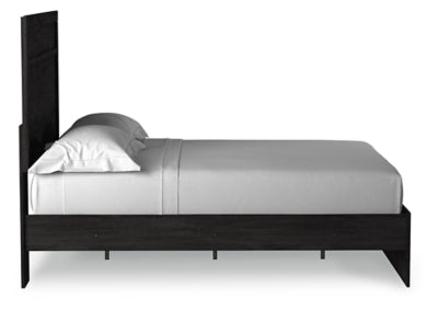 Ashley Furniture Belachime bed with a sturdy wooden frame and sleek design, shown in a side view.
