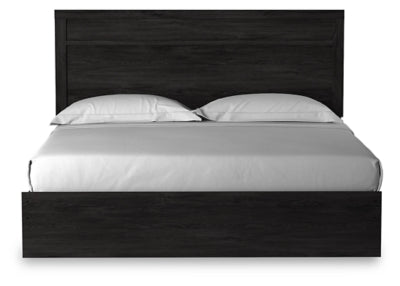 Ashley Furniture Belachime bed with a wooden headboard featuring a classic design and rich finish.