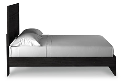 Ashley Furniture Belachime Bed with a wooden frame and side panel, showcasing a stylish and sturdy bedroom centerpiece.