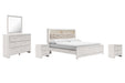 Ashley Furniture Altyra bedroom set with a modern bed frame, matching nightstands, and a coordinated dresser in a stylish bedroom.