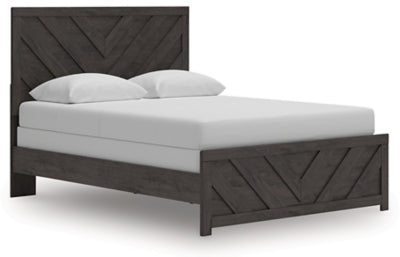 Ashley Furniture Prendonea Bed with angled view showcasing its elegant wooden frame and classic design.