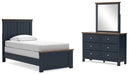 Ashley Furniture Landocken bedroom set with a bed, nightstands, and dresser in a modern bedroom interior.
