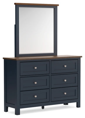 Ashley Furniture Landocken bedroom set with a bed, nightstands, and dresser in a stylish bedroom scene.