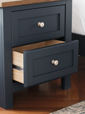 Ashley Furniture Landocken Bedroom Set featuring a bed frame, nightstands, and dresser in a modern bedroom design.