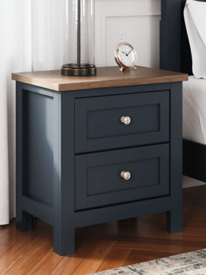 Ashley Furniture Landocken Bedroom Set featuring a bed frame, nightstands, and dresser in a modern bedroom design.