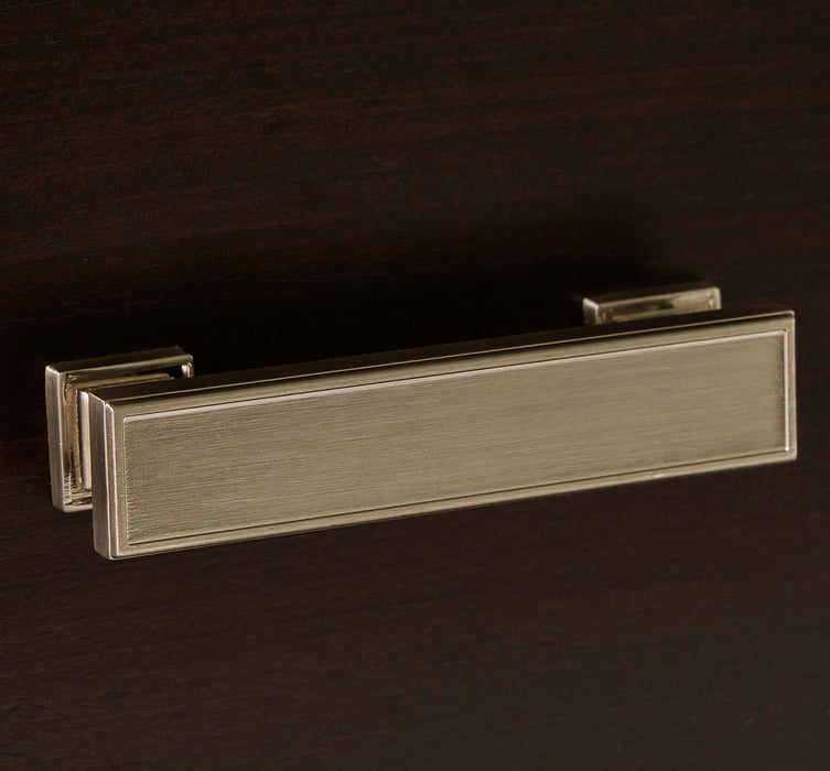 Close-up of Ashley Furniture Covetown Chest of Drawers showing detailed drawer handle and wood finish.