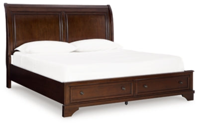 Ashley Furniture Trellington Sleigh Storage Bed with curved headboard and footboard, shown from an angled side view.